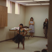 A child performs a Hawaiian hula dance at the Weston Branch's talent show