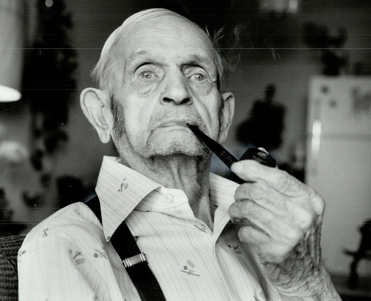 100 year-old-man's hobby is smoking his pipe
