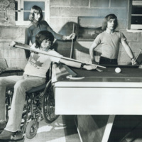 Shooting pool in a Scarborough basement